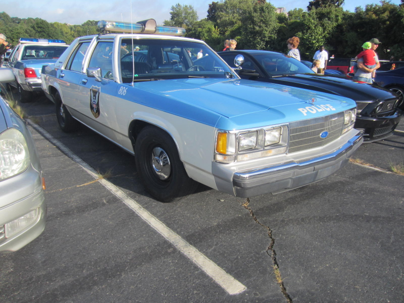 Not one, but TWO classic Crown Vic Charlotte police cars.